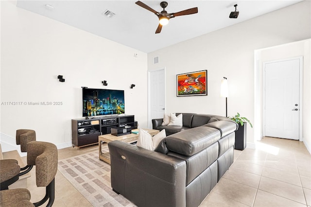 living room with light tile patterned floors and ceiling fan