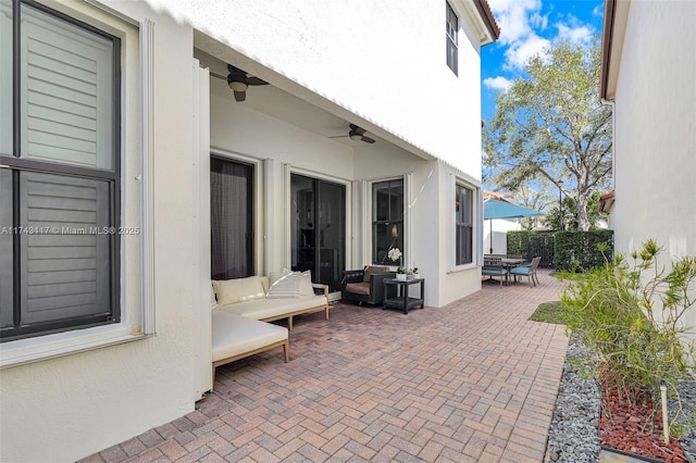 view of patio / terrace with ceiling fan and an outdoor hangout area