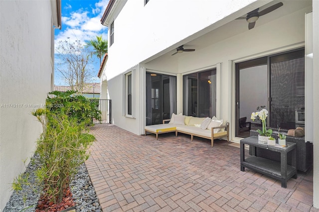 view of patio featuring ceiling fan and outdoor lounge area