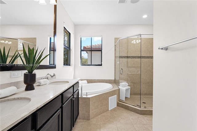 bathroom with tile patterned floors, plus walk in shower, and vanity