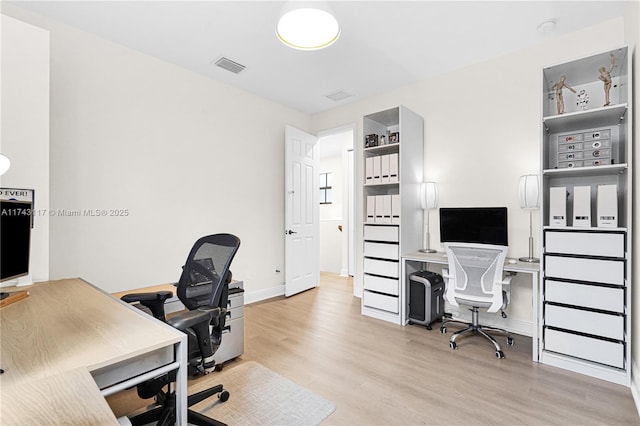 office area with light wood-type flooring