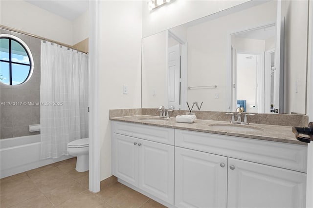 full bathroom featuring vanity, tile patterned floors, shower / bath combo with shower curtain, and toilet