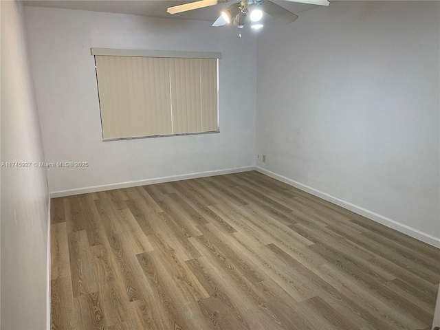 8290 Lake Dr Unit 223, Doral, FL 33166 - unfurnished room with baseboards, ceiling fan, and wood finished floors