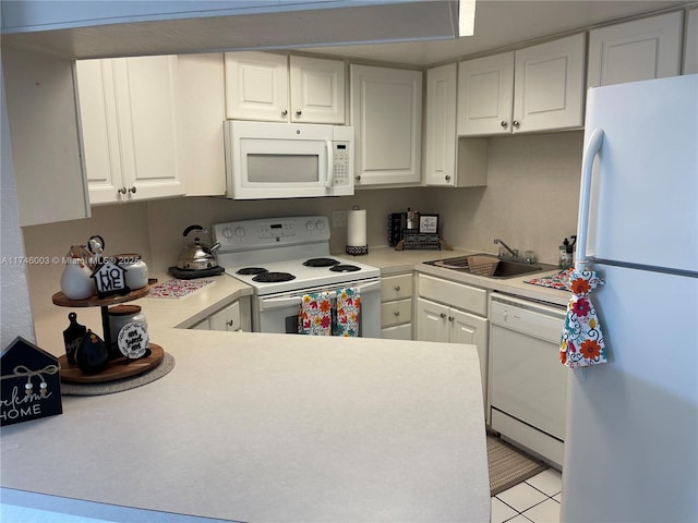 8225 Lake Dr Unit 502, Doral, FL 33166 - kitchen with white cabinetry, light countertops, a sink, and white appliances