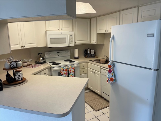 8225 Lake Dr Unit 502, Doral, FL 33166 - kitchen featuring white cabinetry, light countertops, a sink, and white appliances