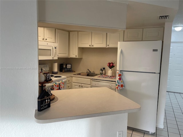 8225 Lake Dr Unit 502, Doral, FL 33166 - kitchen with white cabinetry, light countertops, light tile patterned floors, and white appliances