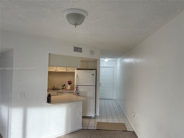 8225 Lake Dr Unit 502, Doral, FL 33166 - hallway with light tile patterned floors, a sink, a textured ceiling, and visible vents