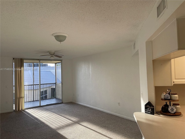 8225 Lake Dr Unit 502, Doral, FL 33166 - unfurnished room with carpet floors, a textured ceiling, baseboards, visible vents, and ceiling fan