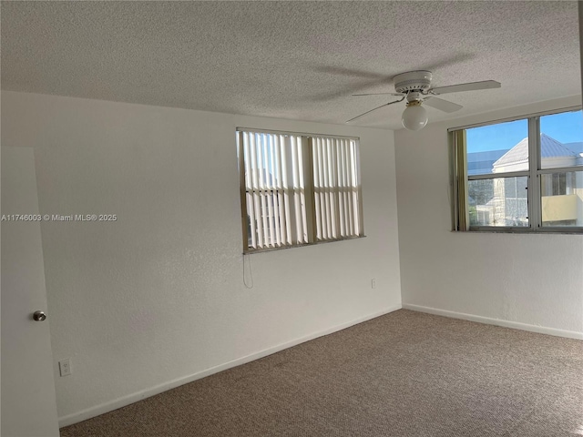 8225 Lake Dr Unit 502, Doral, FL 33166 - empty room with a wealth of natural light, baseboards, carpet flooring, and a ceiling fan