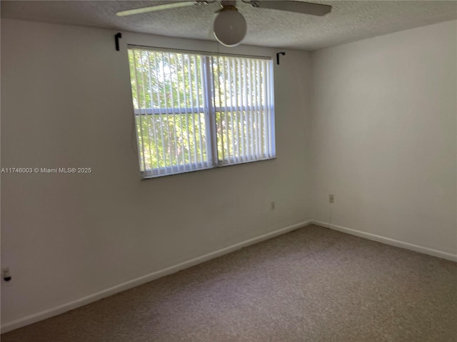 8225 Lake Dr Unit 502, Doral, FL 33166 - spare room featuring a ceiling fan, carpet, baseboards, and a textured ceiling