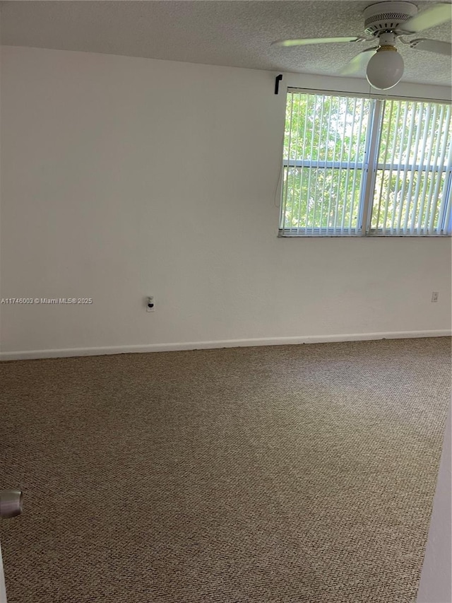 8225 Lake Dr Unit 502, Doral, FL 33166 - carpeted spare room featuring baseboards, a ceiling fan, and a textured ceiling