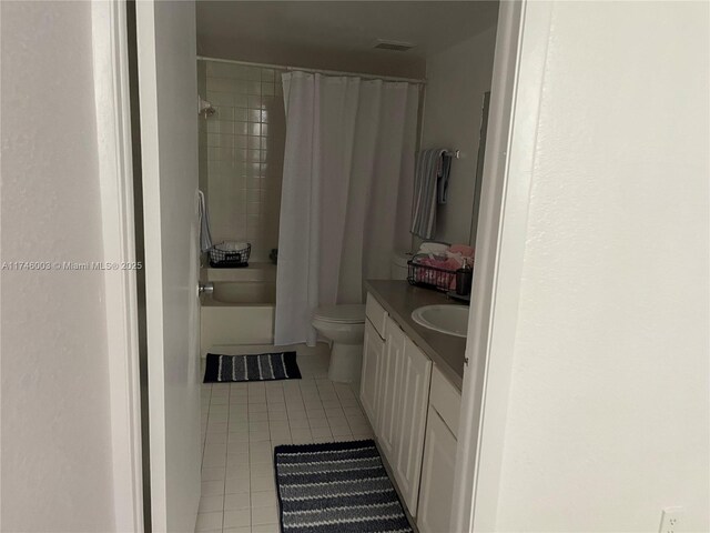 8225 Lake Dr Unit 502, Doral, FL 33166 - full bath featuring toilet, shower / tub combo with curtain, vanity, tile patterned flooring, and visible vents