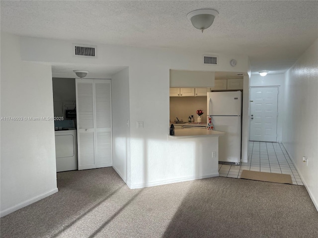 8225 Lake Dr Unit 502, Doral, FL 33166 - empty room with light colored carpet, visible vents, and washer / dryer