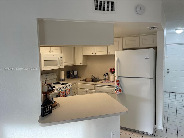 8225 Lake Dr Unit 502, Doral, FL 33166 - kitchen featuring a sink, visible vents, light tile patterned floors, and white appliances