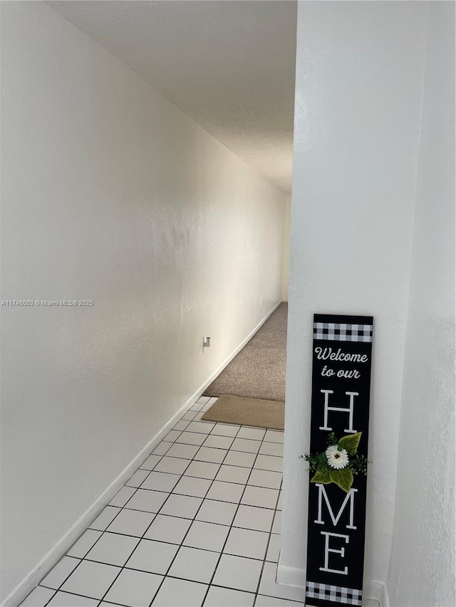 8225 Lake Dr Unit 502, Doral, FL 33166 - corridor with baseboards and light tile patterned floors