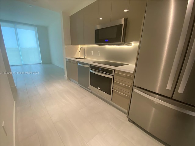 kitchen featuring gray cabinetry, sink, and stainless steel appliances