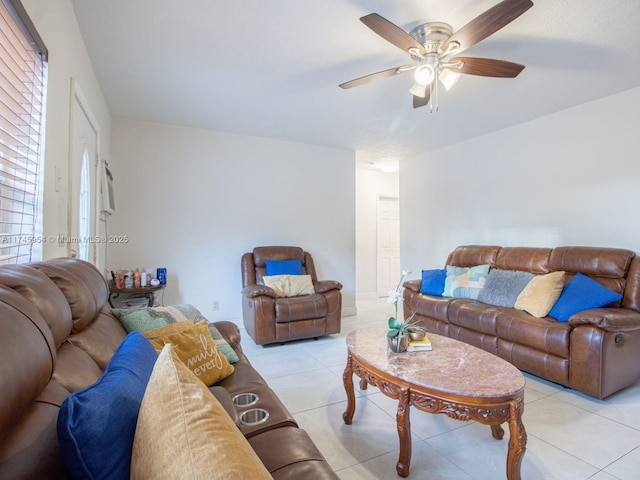 tiled living room with ceiling fan