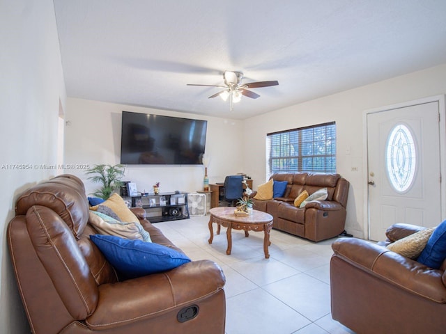 living room featuring light tile patterned floors and ceiling fan