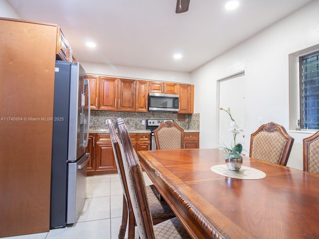 dining area featuring light tile patterned flooring