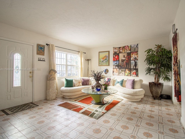 living room with a textured ceiling