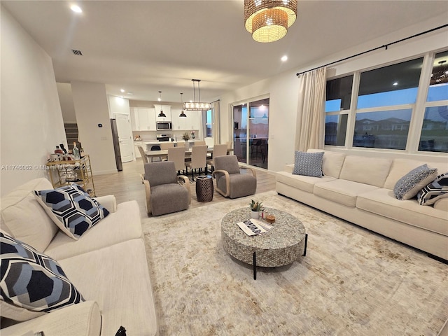 living room with light hardwood / wood-style flooring