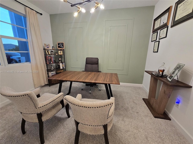 office featuring light carpet and a chandelier