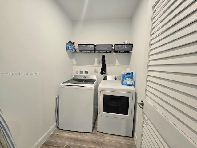 washroom featuring washing machine and clothes dryer