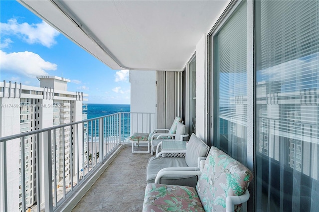 balcony featuring a water view