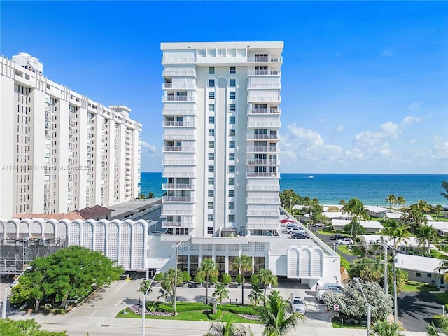 view of building exterior with a water view