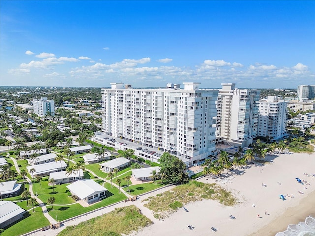 birds eye view of property featuring a view of the beach and a water view