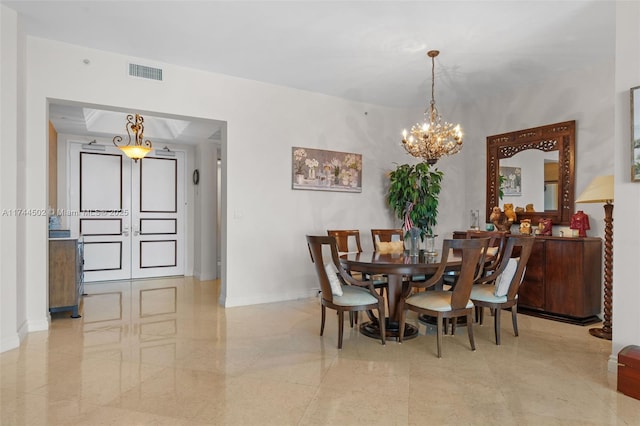 dining room featuring a notable chandelier