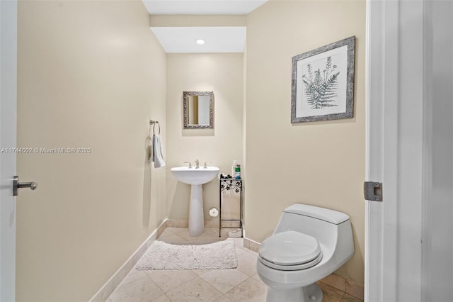 bathroom featuring tile patterned floors and toilet