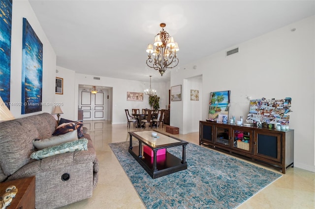 living room featuring ceiling fan with notable chandelier