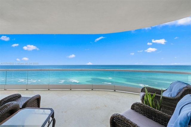 balcony featuring a water view