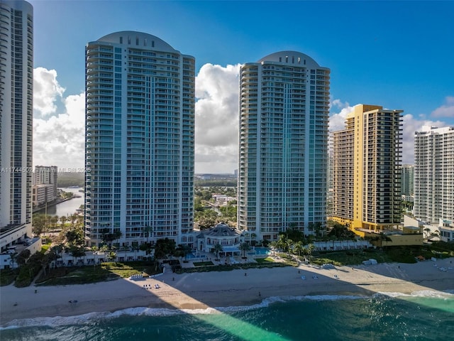 exterior space featuring a beach view and a water view