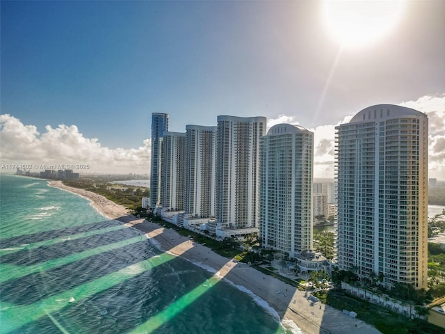 property's view of city with a water view and a view of the beach