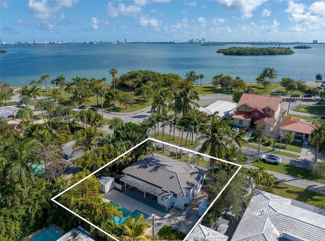 birds eye view of property with a water view