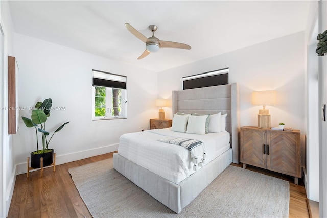 bedroom featuring hardwood / wood-style floors and ceiling fan