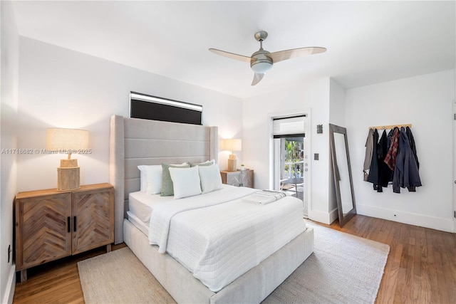 bedroom featuring hardwood / wood-style flooring, ceiling fan, and access to exterior