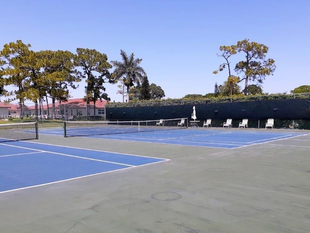 view of tennis court featuring basketball court