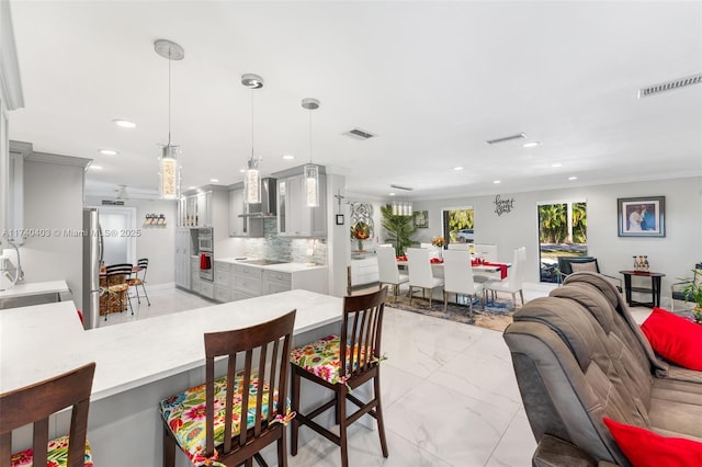 16520 SW 80th Ave, Palmetto Bay, FL 33157 - kitchen featuring recessed lighting, light marble finish floors, ornamental molding, light countertops, and gray cabinetry