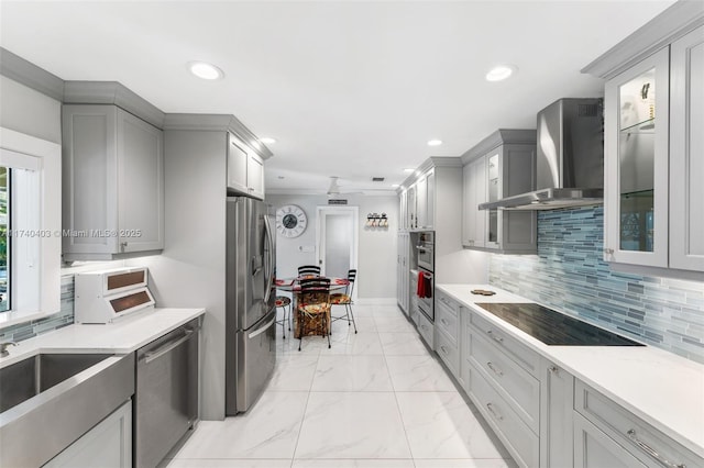 16520 SW 80th Ave, Palmetto Bay, FL 33157 - kitchen with appliances with stainless steel finishes, wall chimney range hood, gray cabinetry, recessed lighting, and glass insert cabinets