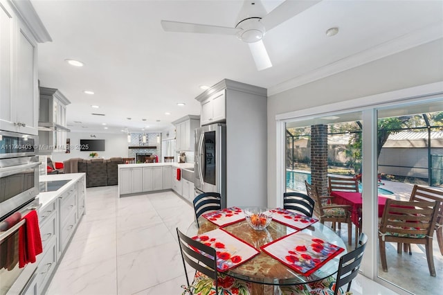16520 SW 80th Ave, Palmetto Bay, FL 33157 - dining room with a ceiling fan, recessed lighting, ornamental molding, and light marble finish floors