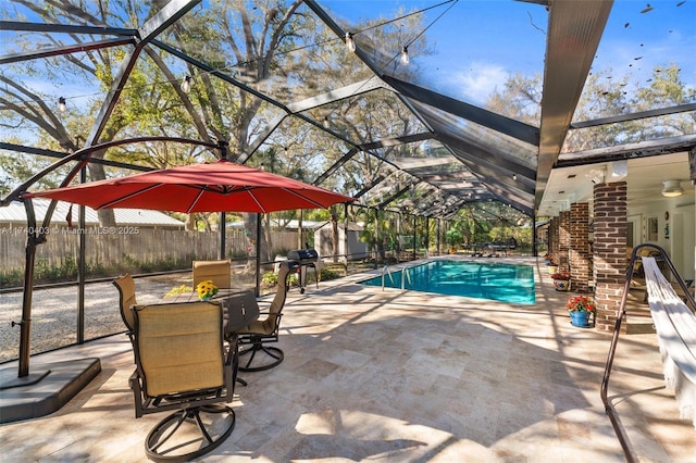 16520 SW 80th Ave, Palmetto Bay, FL 33157 - view of swimming pool with a patio, a storage unit, a fenced backyard, and a lanai
