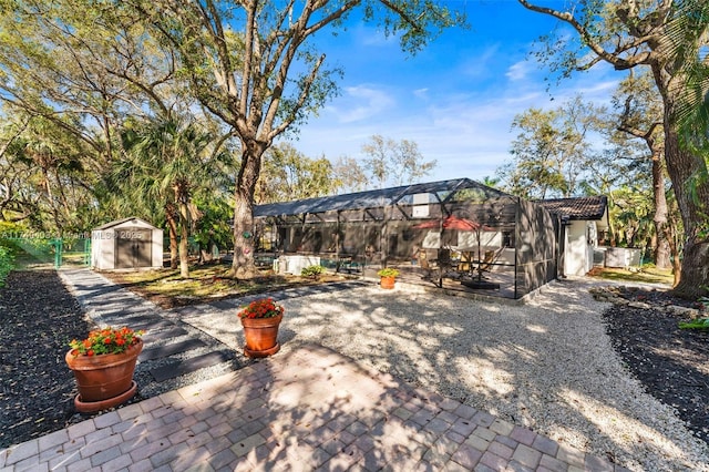 16520 SW 80th Ave, Palmetto Bay, FL 33157 - view of patio / terrace with a storage unit and a lanai