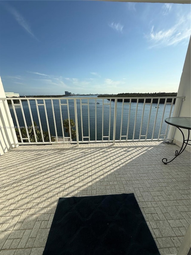 balcony featuring a water view