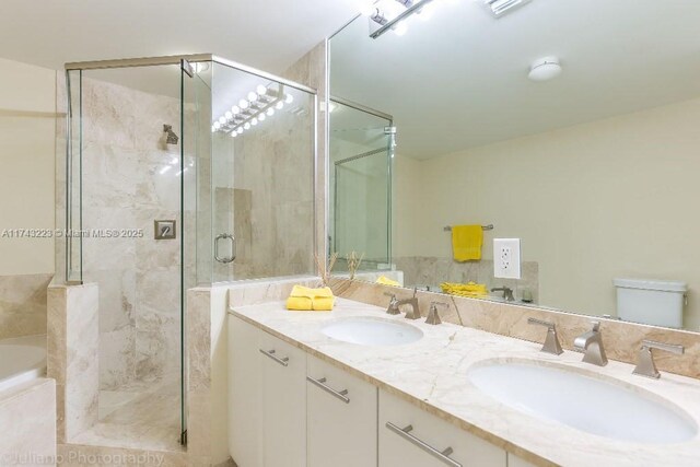 510 NW 84th Ave Unit 640, Plantation, FL 33324 - bathroom with a stall shower, double vanity, and a garden tub
