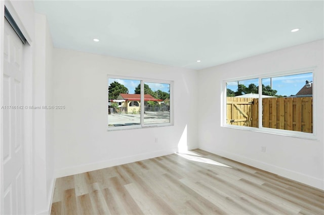 unfurnished room featuring light wood-type flooring