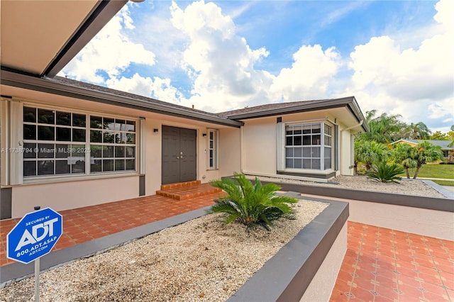 view of front of house featuring stucco siding