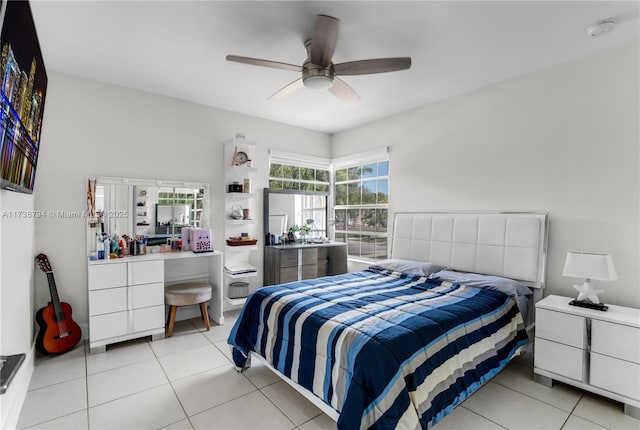 bedroom with a ceiling fan and light tile patterned flooring